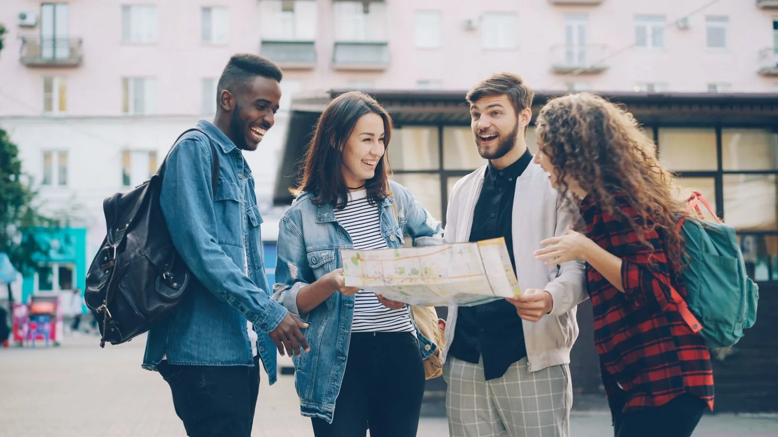 A group of friends exploring a city together with a map